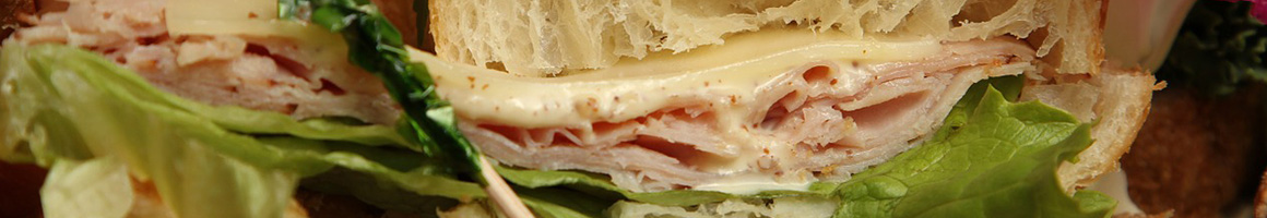 Eating Breakfast & Brunch Sandwich at Marian's Bagels restaurant in Plantation, FL.